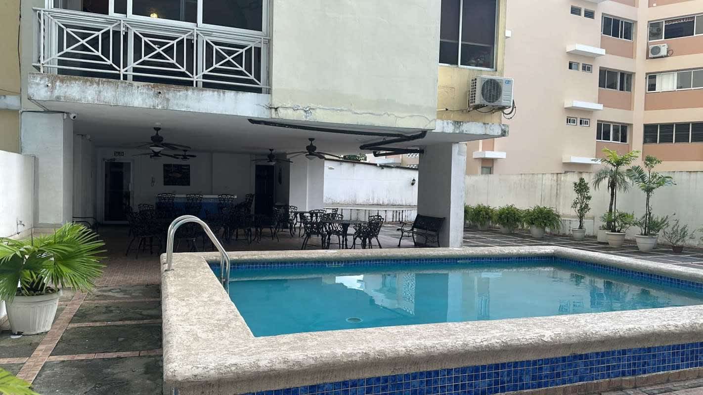 Living room with tiled floor, large window, balcony access PH Park View La Loma