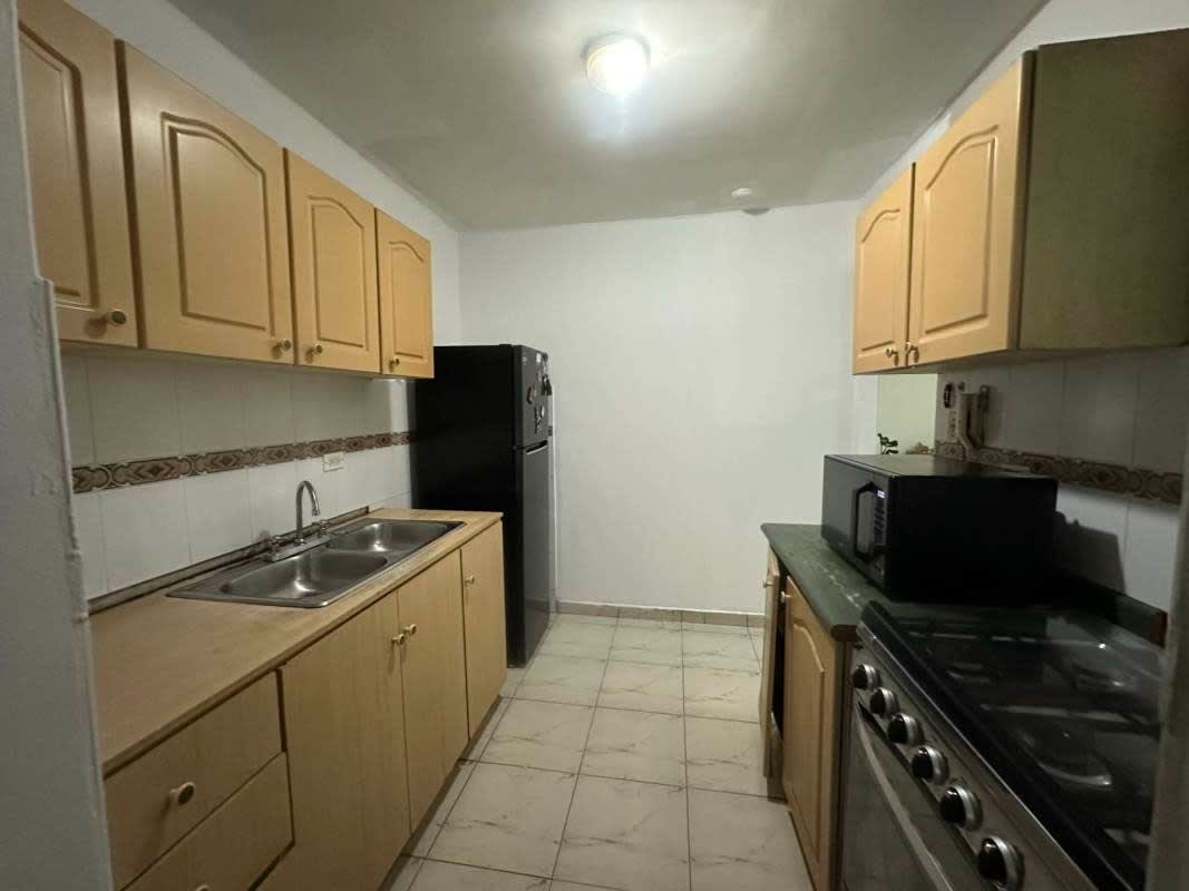 Laundry room with washer and utility sink in PH Park View La Loma