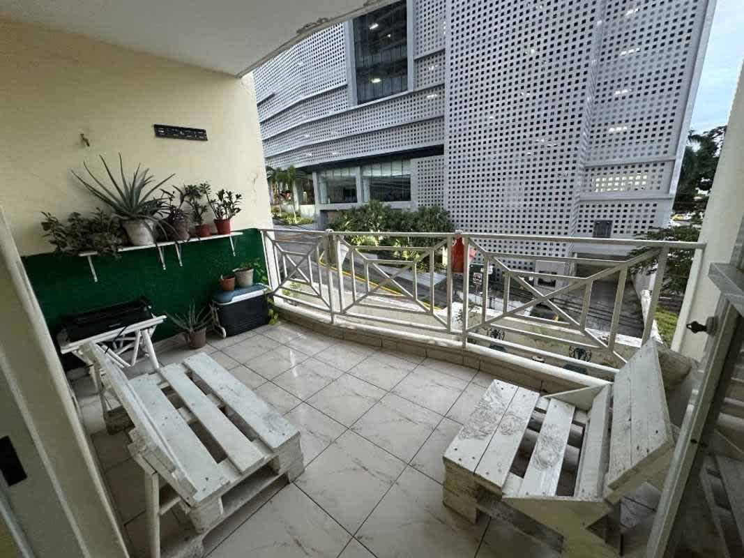 Family living space with balcony door PH Park View Panama City