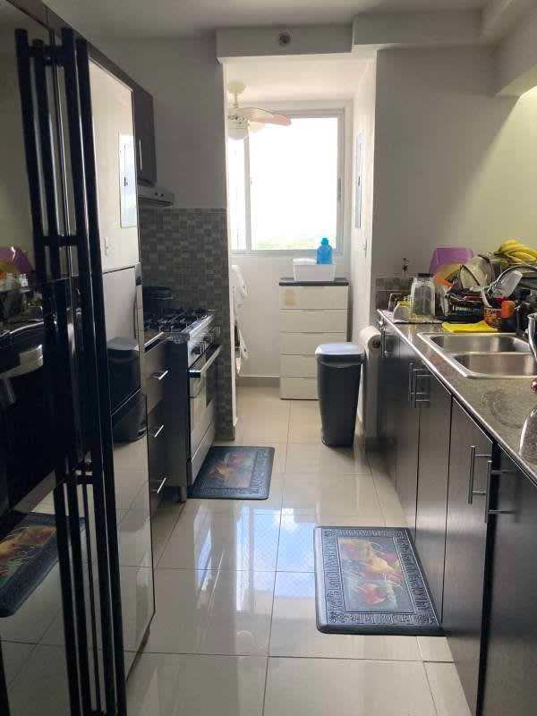 Laundry space with washing machine and storage in PH Centennial Chanis Panama