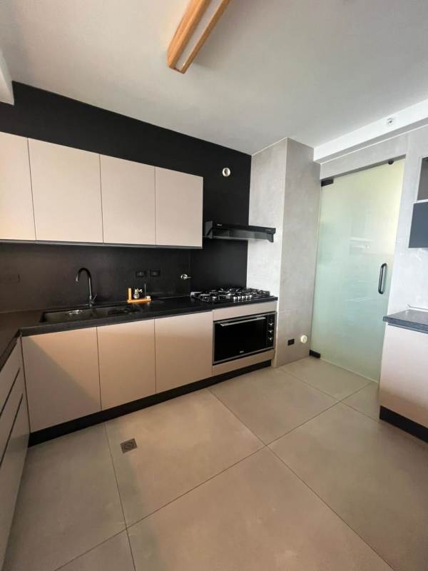 Infinity swimming pool with skyline views and sun deck at PH Victory San Francisco Panama