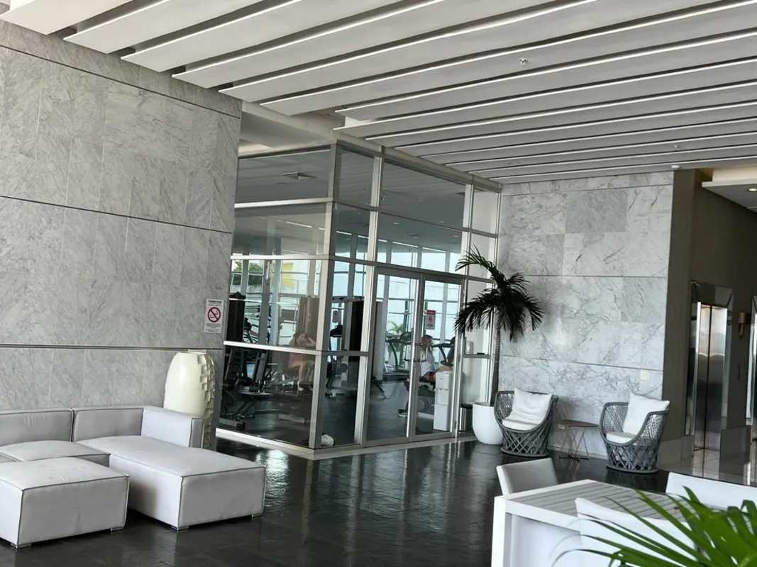 Furnished master bedroom with ocean view windows PH Water On The Bay Panama City