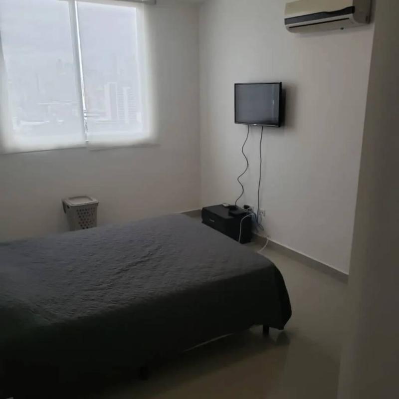 Spacious living and dining room with city view balcony access in PH Diamond Tower Panama City