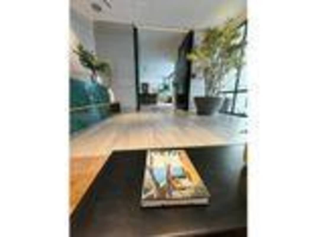 Expansive lobby with modern decor and seating at Santa Maria Court Panama City