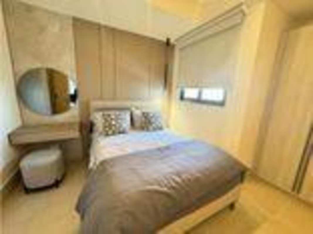 Bright master bedroom with padded headboard and view PH Santa Maria Court Panama