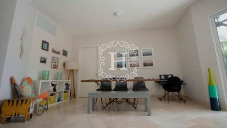 Contemporary open-plan living and dining room with patio access and natural light Puntarena Beach Club Panama