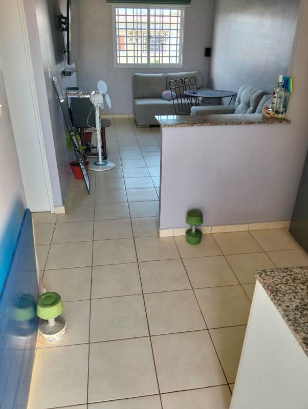 Backyard view with laundry sink, patchy lawn and clothesline rental house Altos del Azul Cabra