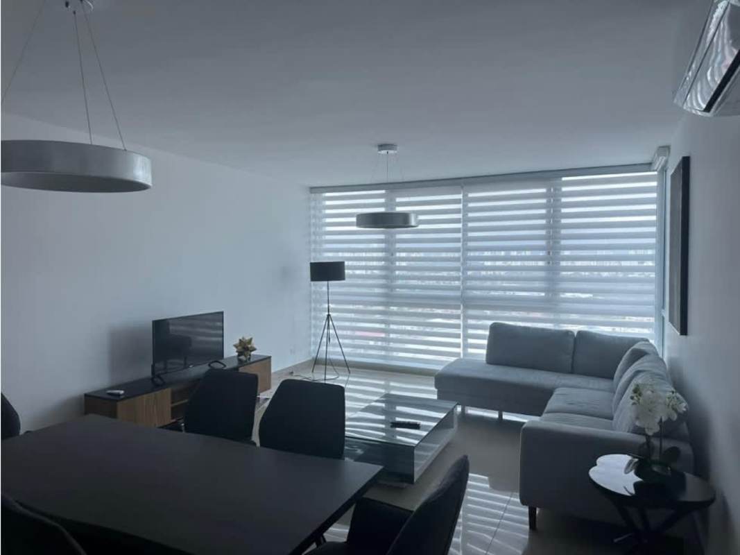 Open plan living and dining with floor-to-ceiling windows PH Top Towers Costa del Este Panama