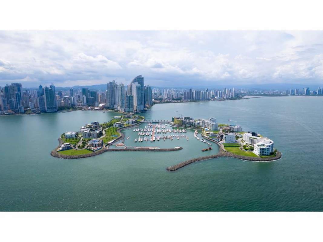 Beachfront condo tower with palm trees infinity pool and ocean at Ocean Reef Islands Panama