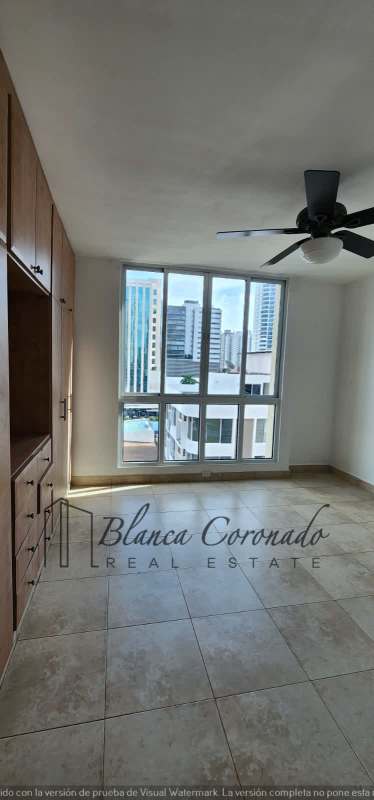 Modern bedroom with large window city skyline built-in closet in PH Portofino San Francisco Panama