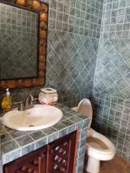 Traditional style kitchen with breakfast bar, appliances, tiled finishes in Coronado house for sale