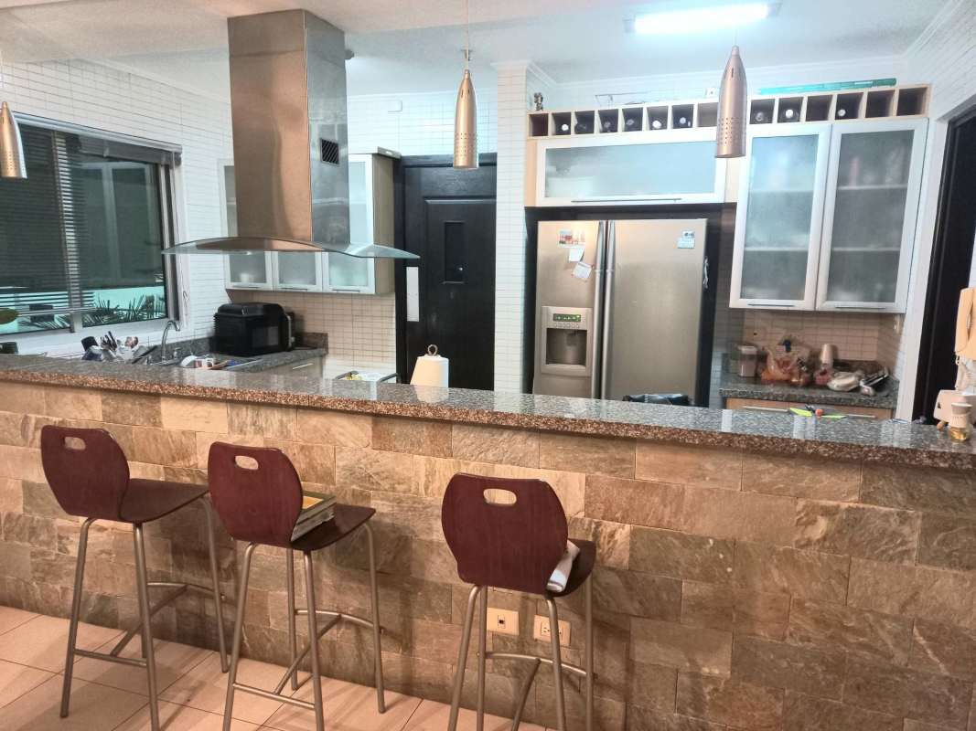 Contemporary kitchen with granite counters, stainless appliances, breakfast bar PH Tao Towers Panama City