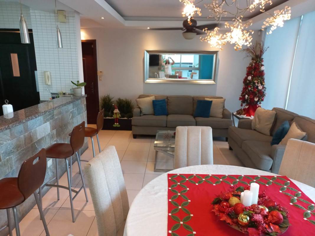 Living area with sofa, dining and open kitchen in PH Tao Towers Panama