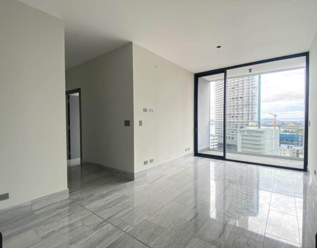Modern kitchen with island, white and black cabinetry, tile floor at Nuovo by Armani Casa Bella Vista Panama
