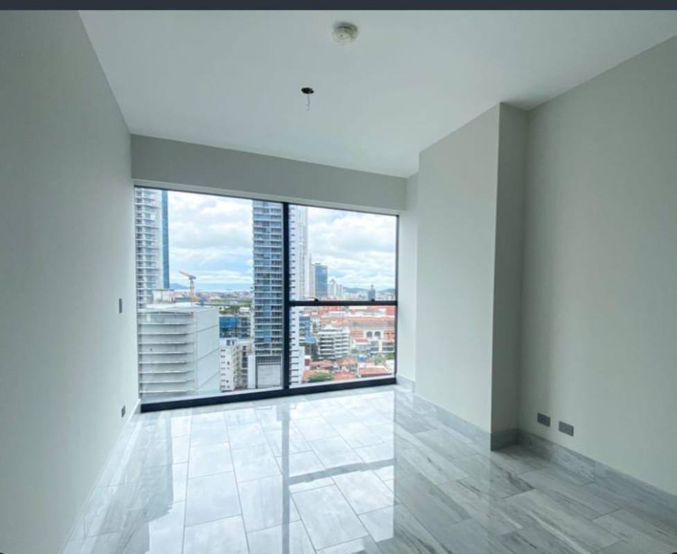 Spacious living area with marble floors, panoramic windows at Nuovo by Armani Casa on Avenida Balboa Panama City
