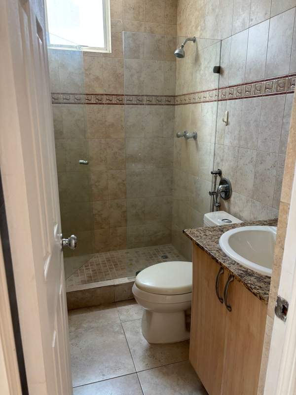 Living room with large floor-to-ceiling windows overlooking Punta Pacifica cityscape in PH Mystic Point Panama City