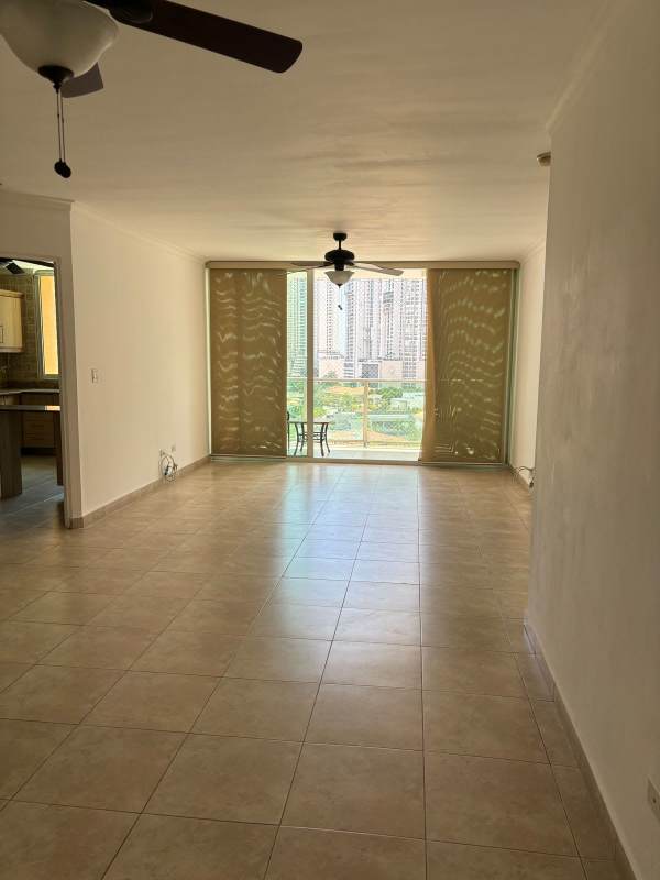 Bedroom with ceiling fan, built-in closet, AC, and window in Punta Pacifica Panama apartment