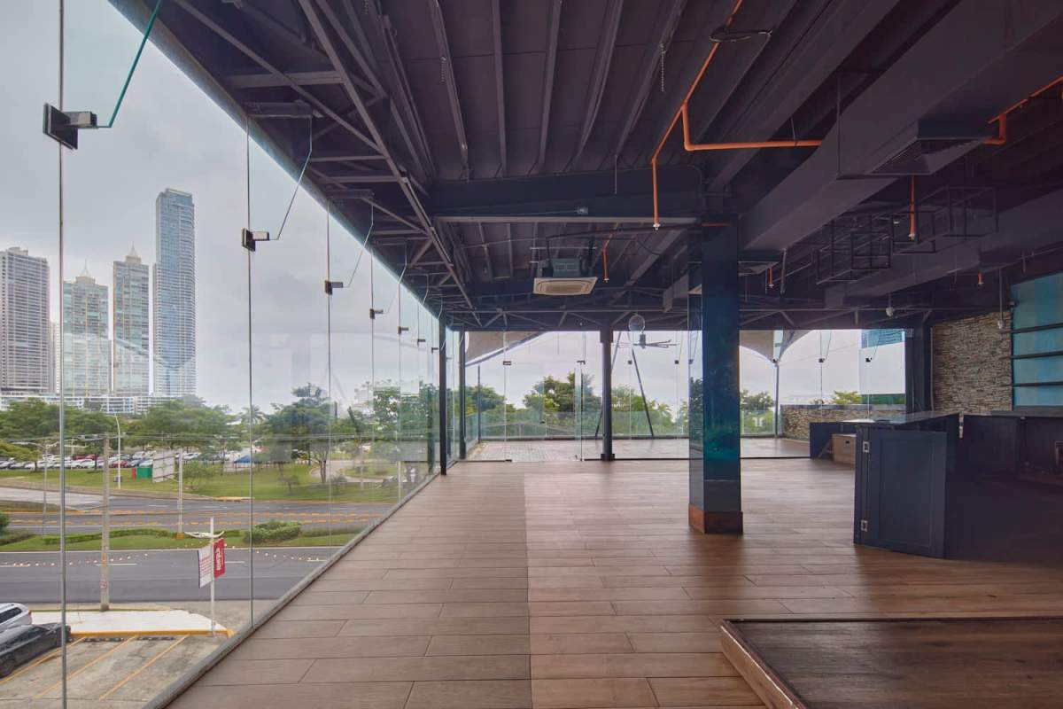 Large covered terrace balcony with ceiling fan, panoramic city skyline view in PH Balboa Boutique Panama