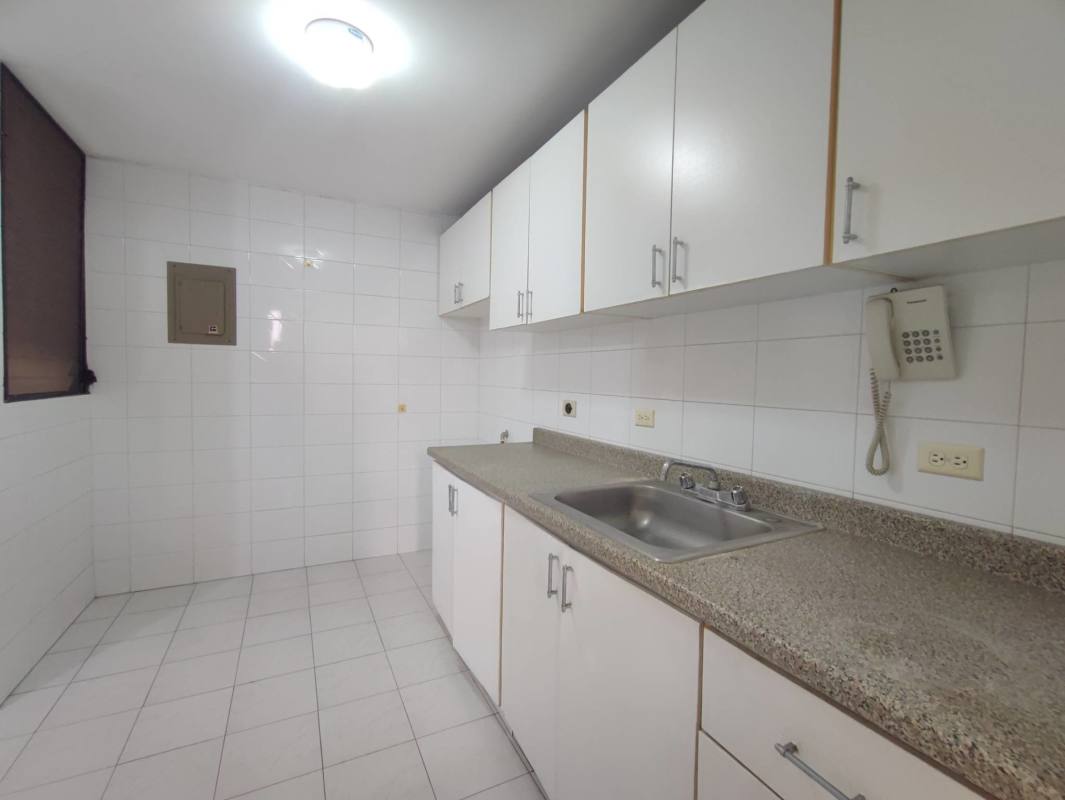 Laundry room with utility sink, water heater and tiled walls at PH Villa Gloriela Panama City