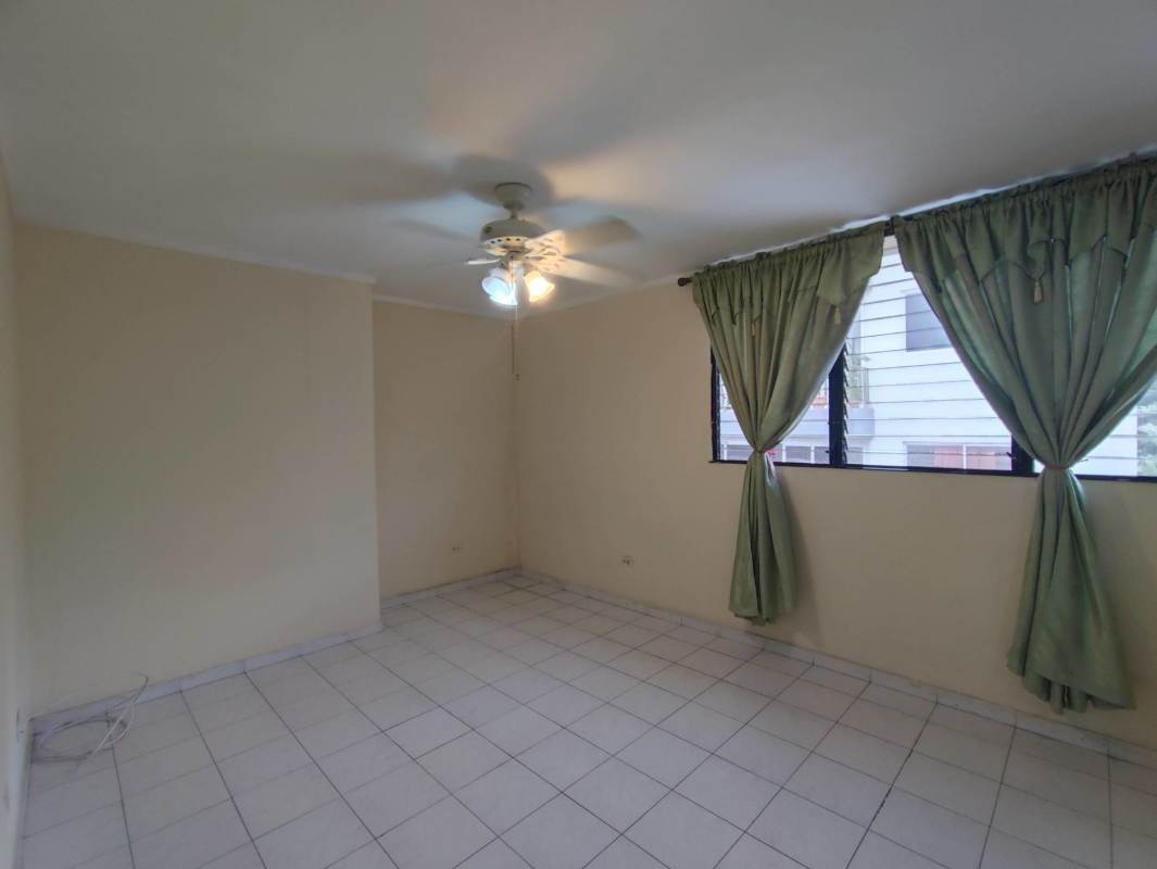 Kitchen with granite countertops, white cabinetry, tiled walls PH Villa Gloriela Panama