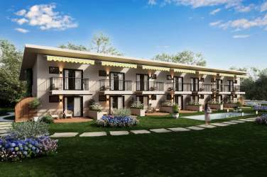 Contemporary low-rise multi-unit building featuring vertical garden wall, parking area and landscaping at Cozy Venao Playa Venao