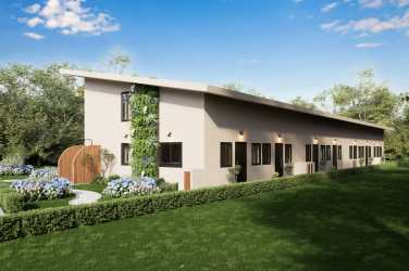 Low-rise townhouse complex with green wall, parking area and tropical landscaping in Playa Venao