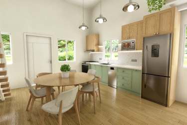 Modern kitchen with green cabinets, stainless steel appliances, dining table in Cozy Venao loft Playa Venao Panama