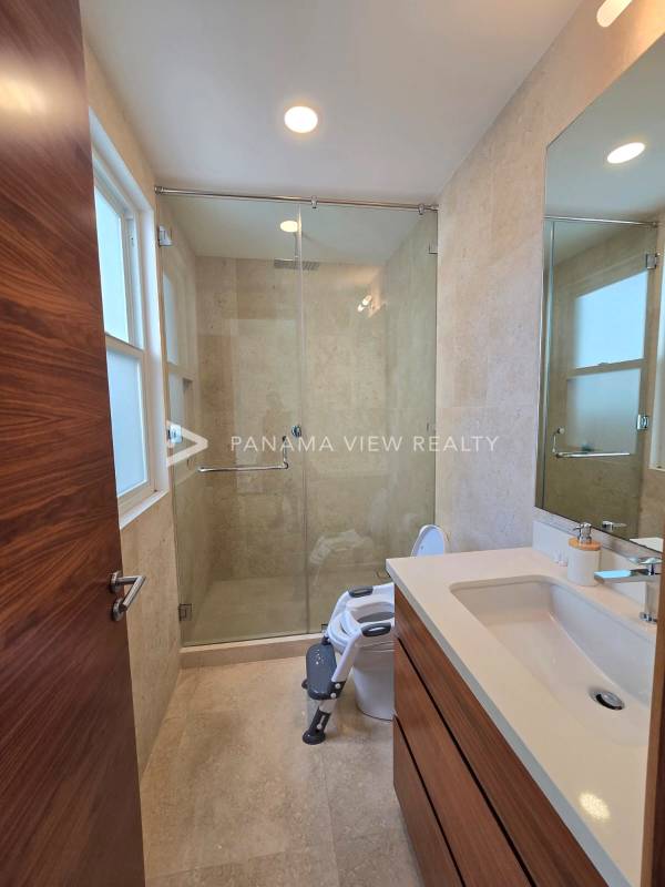 Spacious dining room with marble floors and art in luxury house Santa Maria Panama