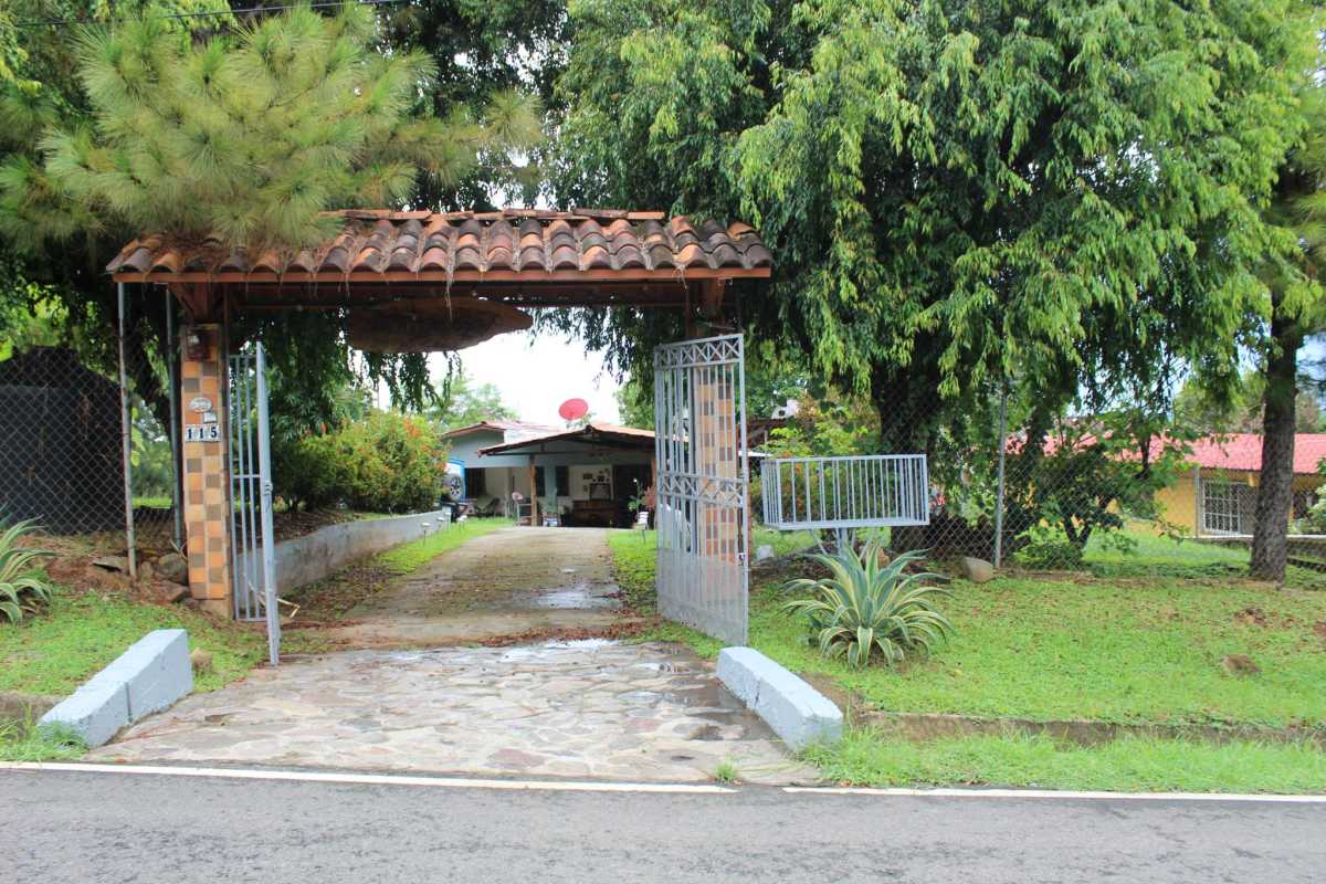 Rustic kitchen with wood cabinetry, ceramic tiles, gas stove in Cerro Azul Panama mountain house