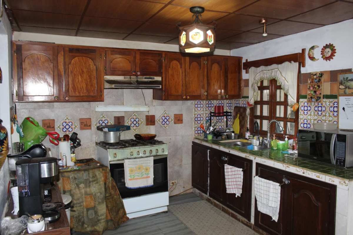 Covered outdoor terrace with seating, garden views in country estate Cerro Azul Panama