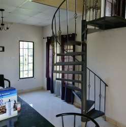 Hilly panoramic countryside near Chicá mountain house with greenery and open plots