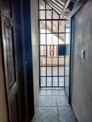 Interior with spiral staircase leading upstairs mountain country home Panama