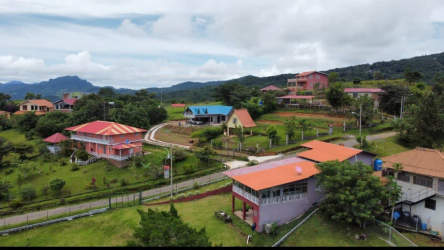 Aerial view of mountain homes, countryside and green mountains in Panama Oeste