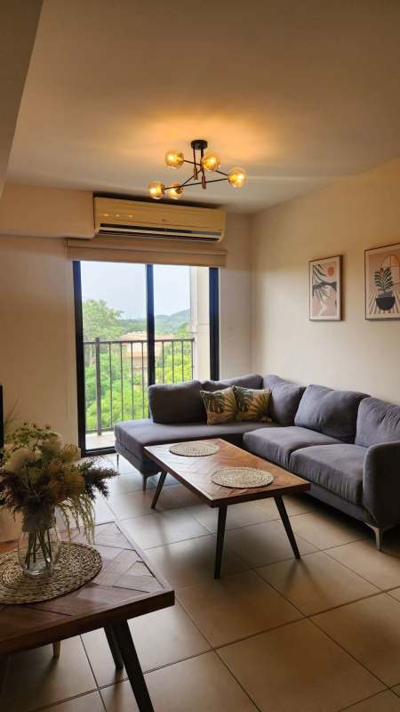 Kitchen with granite backsplash and stainless steel appliances Embassy Club Residences Panama