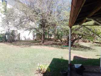 Gated frontage with metal fence commercial property Santiago Panama along highway