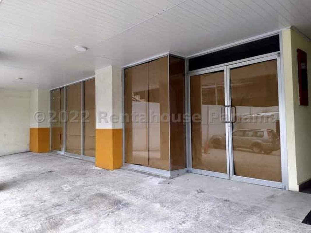 Commercial unit front glass doors and covered entryway in mixed-use center Panama