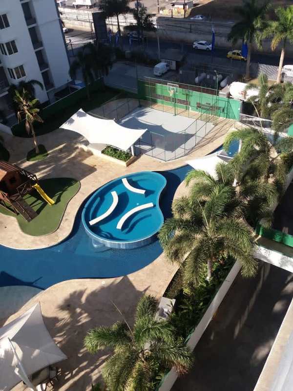 Swimming pool area with palm trees and shaded seating PH Cosmopolitan Towers Panama