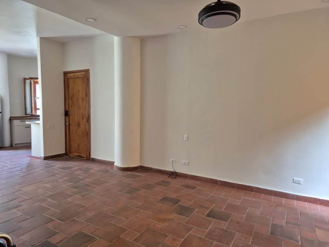 Contemporary kitchen with wood countertops, appliances, and open shelving Casco Viejo rental