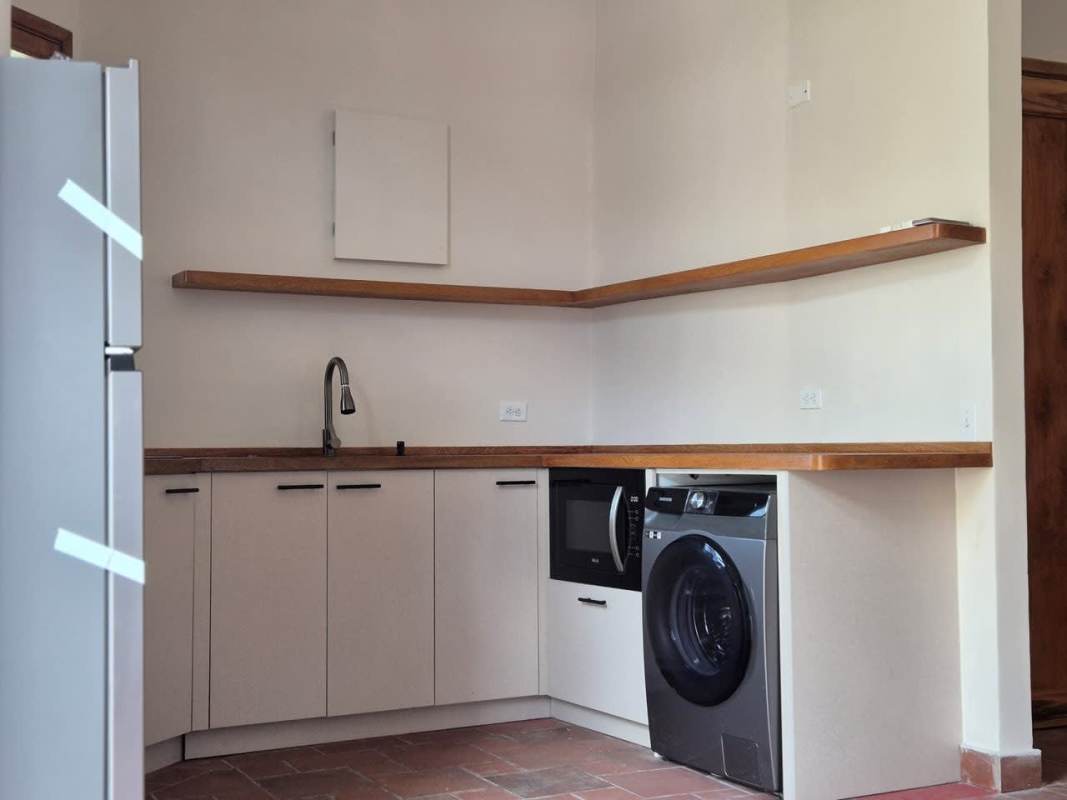 Contemporary bathroom with glass shower, wood counter and vessel sink Casco Viejo rental