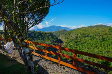 Wooden cabins with garden beds stone path Alto Boquete Panama