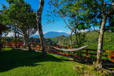 Hammock relaxing area mountain views rustic fence Alto Boquete