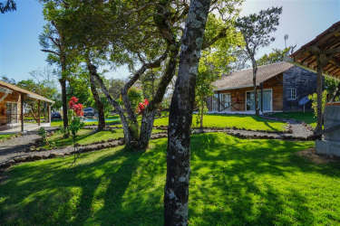 Shaded wooden pavilion with seating area in tourism compound Alto Boquete