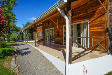 Rustic cabins with wood porch and fenced garden Alto Boquete Panama