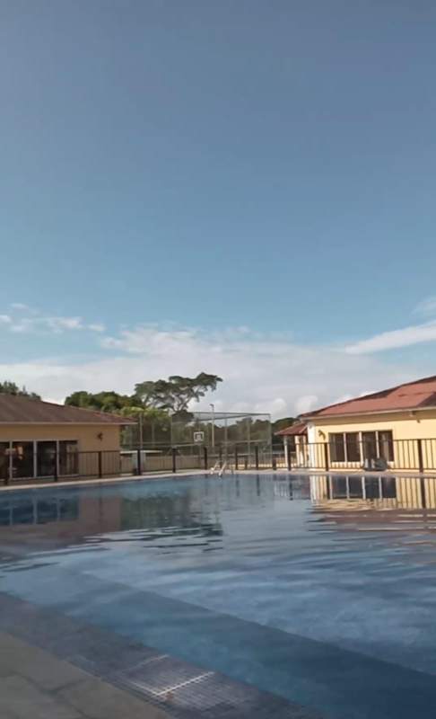 Outdoor swimming pool with sports facility at PH Azahares townhouse community Pedregal Panama