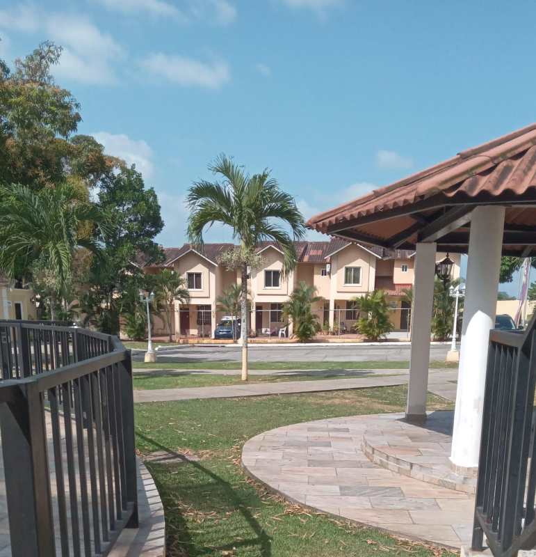 Living room with entertainment wall and staircase in PH Azahares Pedregal Panama