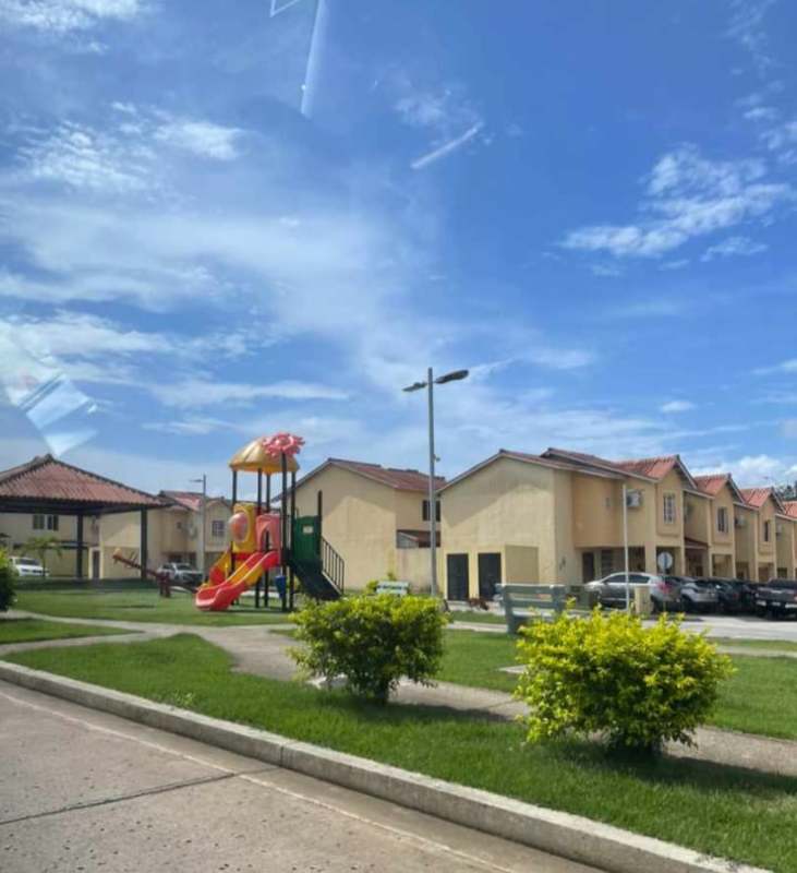 Family-friendly townhouse complex with playground and landscaped greens in PH Azahares Pedregal Panama