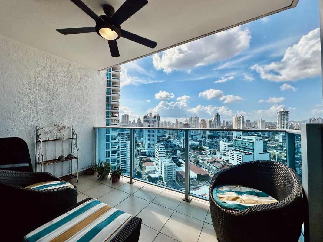 Large balcony with seating offering ocean and skyline views PH Waterfalls Panama City