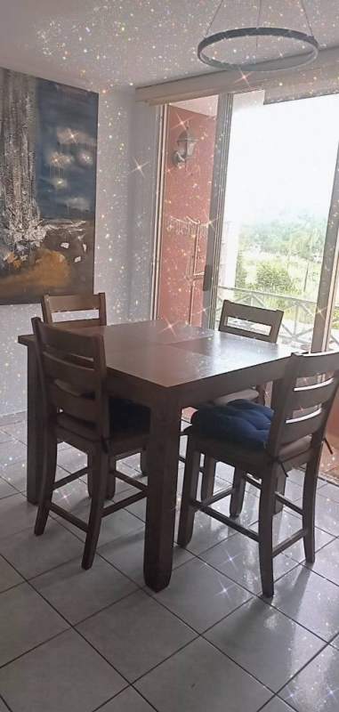 Comfortable living room with sofa, wall art, tiled floor inside PH Torres de Milán near UTP Panama City