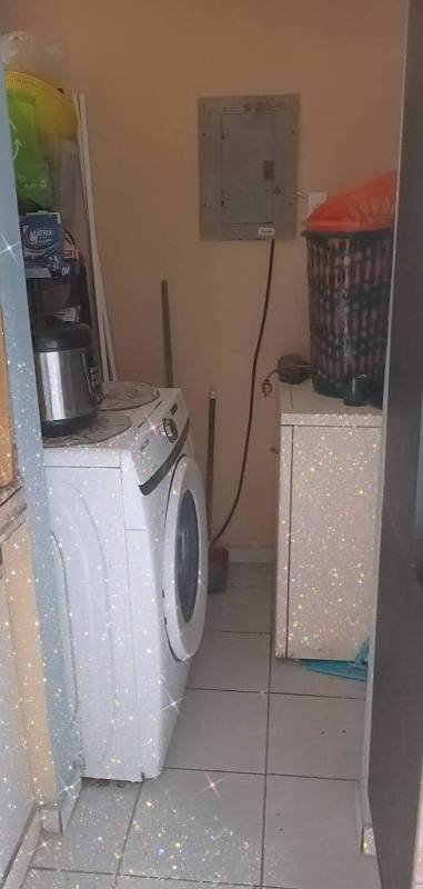Bathroom featuring glass enclosed shower, pedestal sink, modern toilet, tiled walls at PH Torres de Milán Panama City