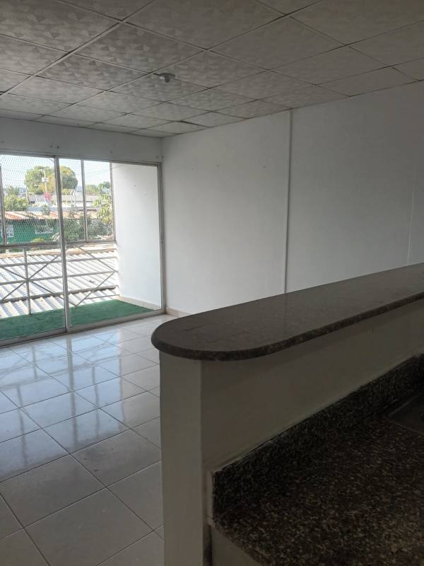 Open kitchen with marble backsplash and breakfast divider Pedregal apartment rental